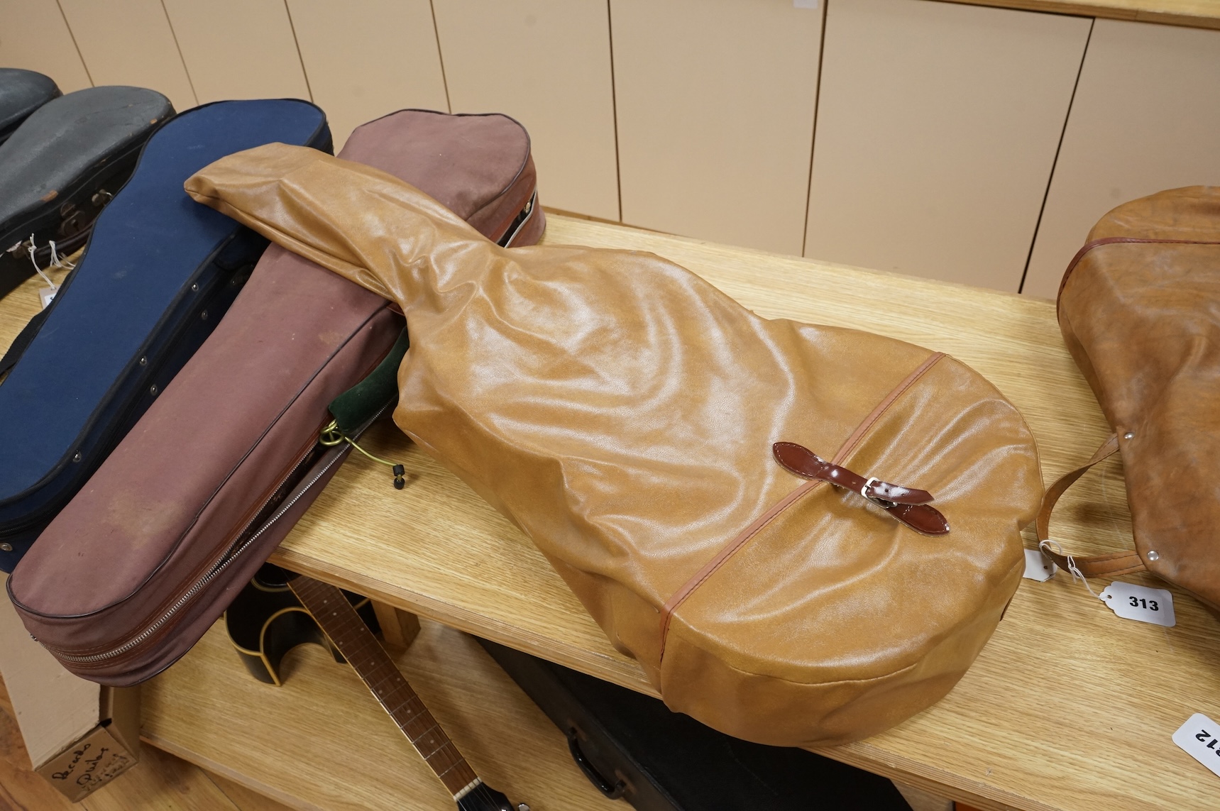 A handmade cedar, Indian Rosewood and ebony classical guitar by 'an English Luthier', with label to the inside of the body, together with a soft case.